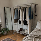 Stowena 75 in double rod rolling clothes rack, 630 lb, in use