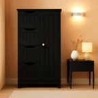 Stowena black bathroom floor cabinet with 4 drawers and cupboard beside a side table