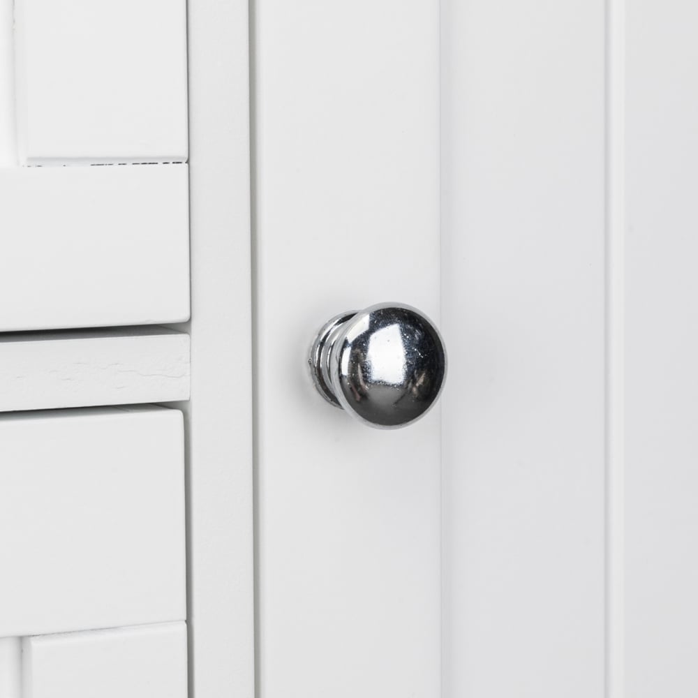 Brushed metal knob detail on beadboard drawer front