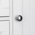 Brushed metal knob detail on beadboard drawer front