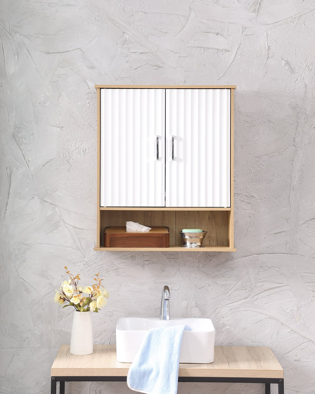 Fluted bathroom wall cabinet in white and natural mounted above a vanity sink