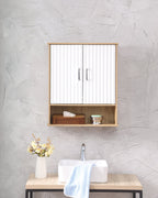 Fluted bathroom wall cabinet in white and natural mounted above a vanity sink