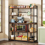 Rustic brown five tier bakers rack holding a coffee machine, microwave and jars in a bright kitchen