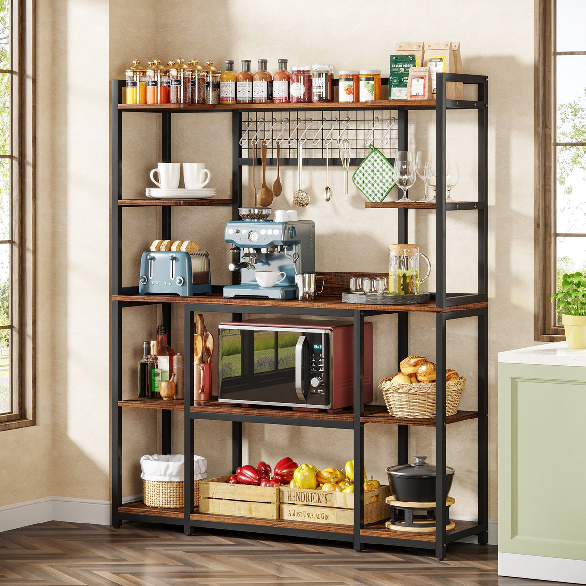 Rustic brown five tier bakers rack holding a coffee machine, microwave and jars in a bright kitchen
