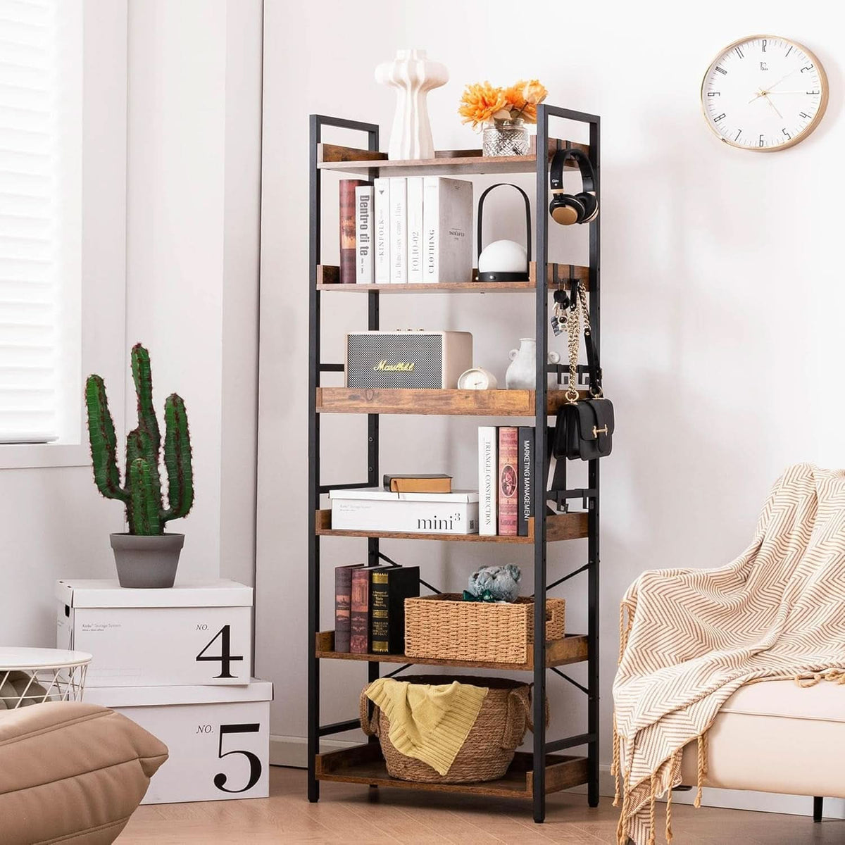 Close view of two shelves and the side hooks, showing the raised front rails on the shelf edges and a bag hanging from the frame