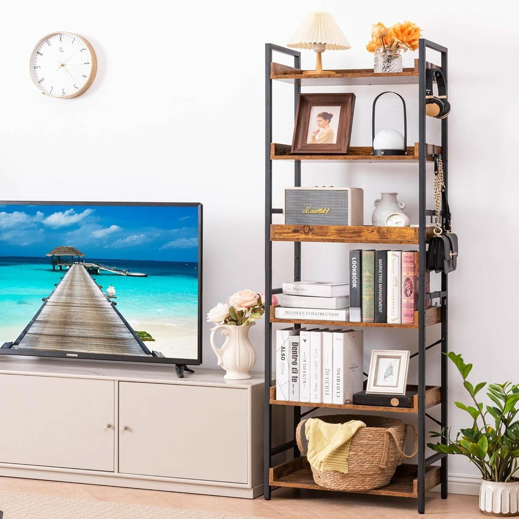 The 6 tier bookshelf beside a media unit holding books, a picture frame, a lamp and a basket, with headphones and a bag on the side hooks