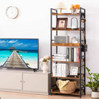 The 6 tier bookshelf beside a media unit holding books, a picture frame, a lamp and a basket, with headphones and a bag on the side hooks