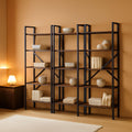 Stowena wide rustic brown bookshelf with 11 open shelves against a living room wall