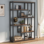Staggered shelf bookcase holding books, plants and ornaments