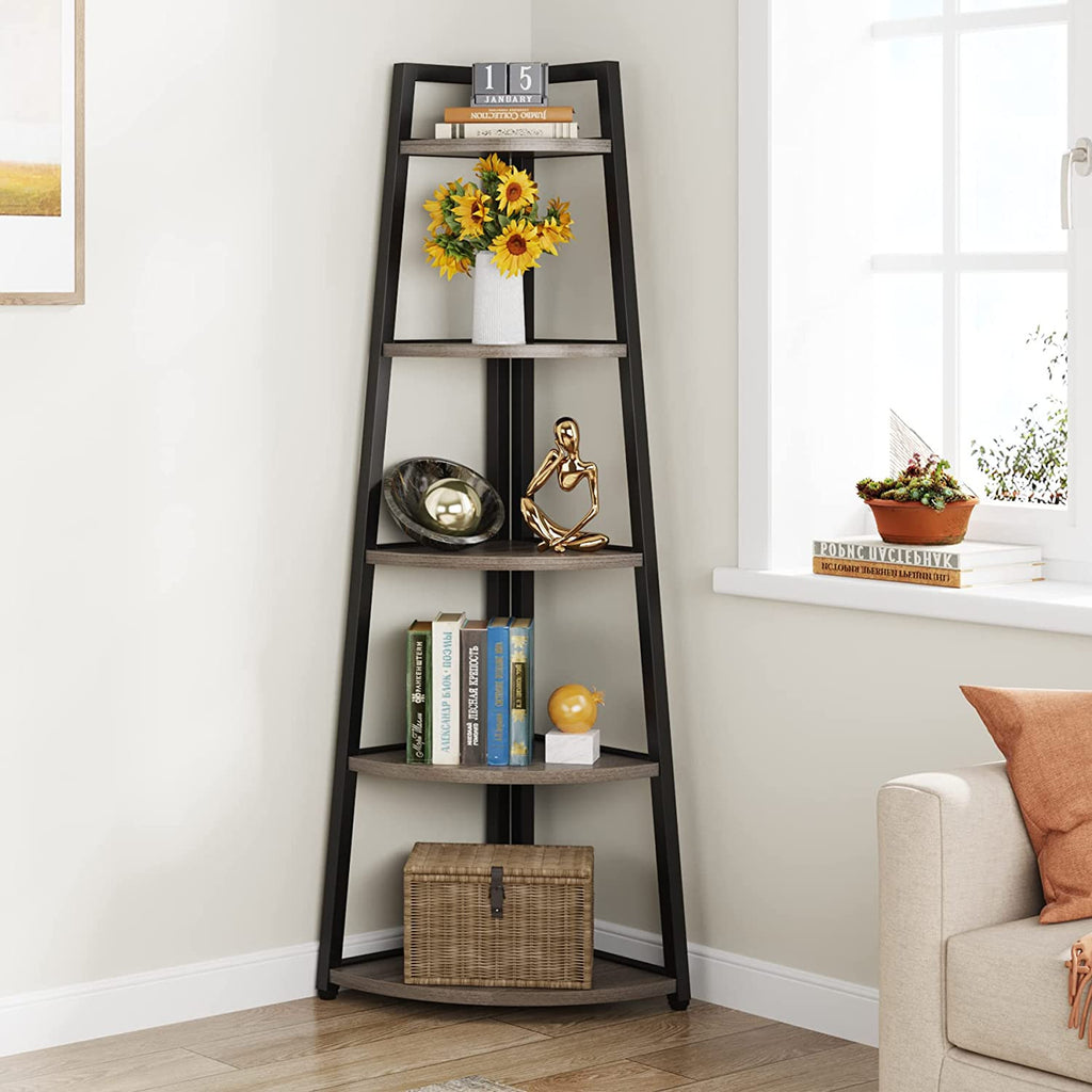 Tall corner bookshelf holding flowers, books and storage boxes