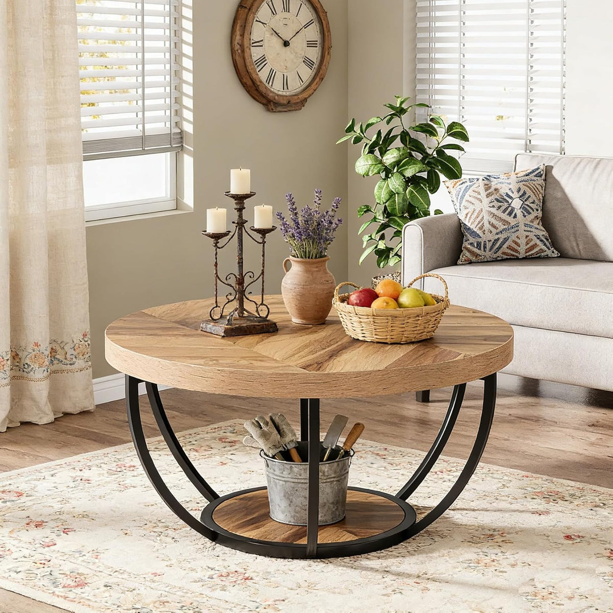 Round 2-tier coffee table styled in a living room with a plant and dishes