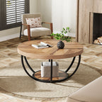 Round coffee table with curved steel legs on a rug in a bright living room