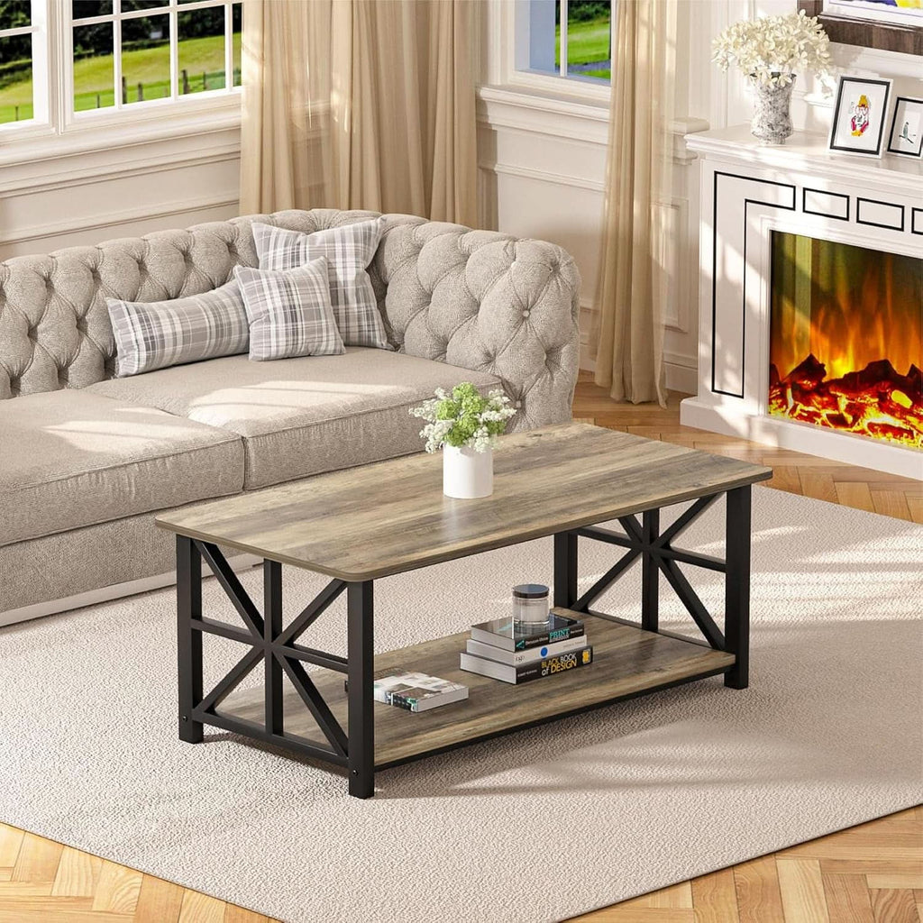 The gray wash coffee table in front of a fireplace with a sofa behind it