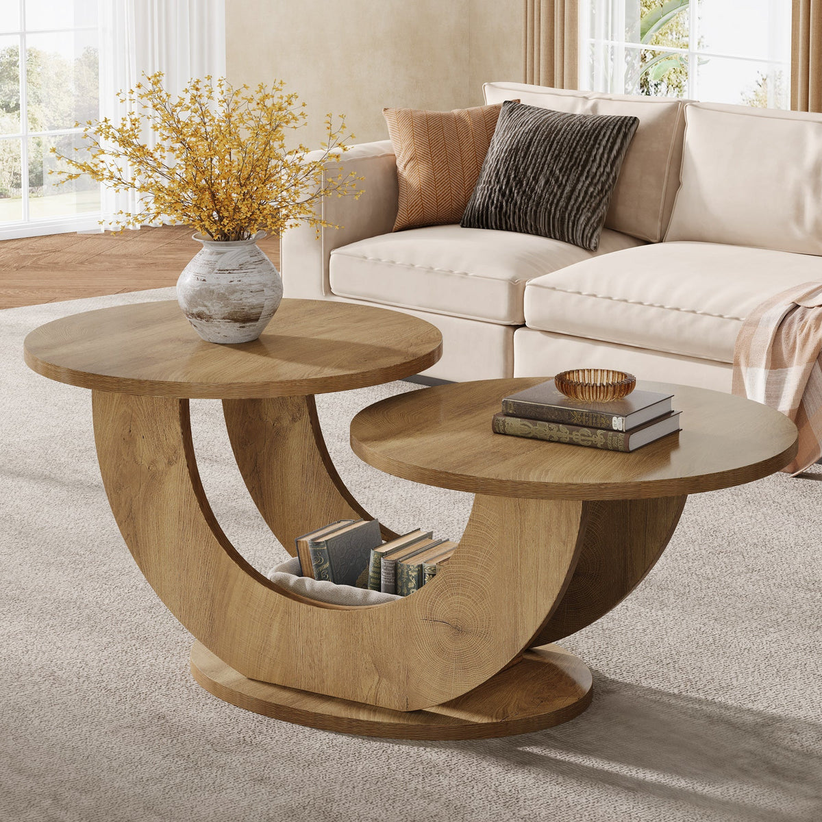 Two tier oak coffee table beside a sofa holding a vase and a bowl
