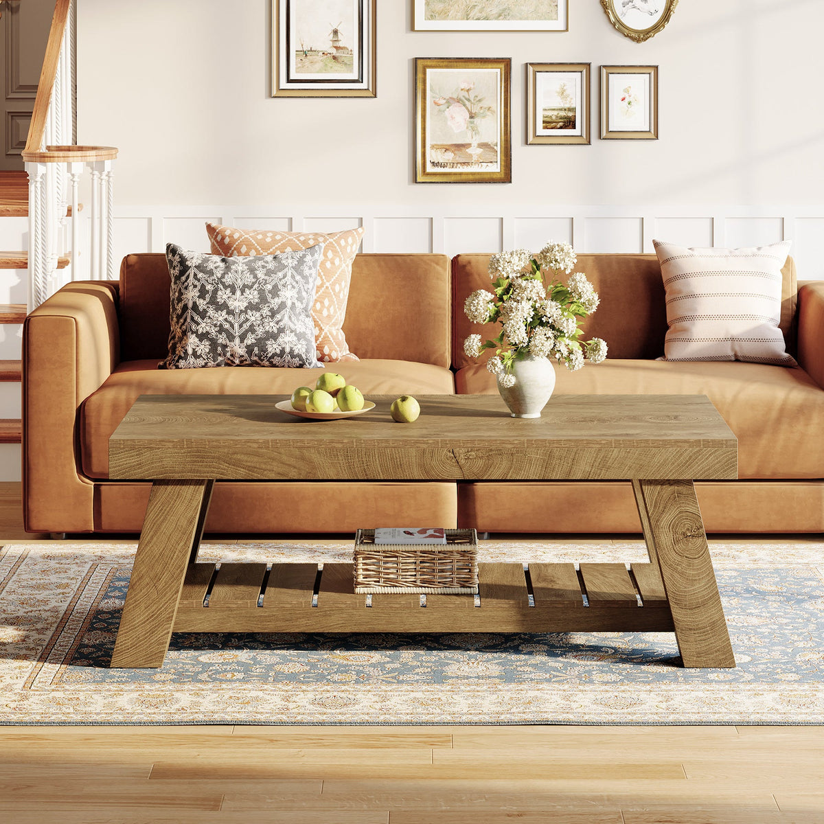 Farmhouse coffee table with slatted lower shelf holding a basket in front of an orange sofa