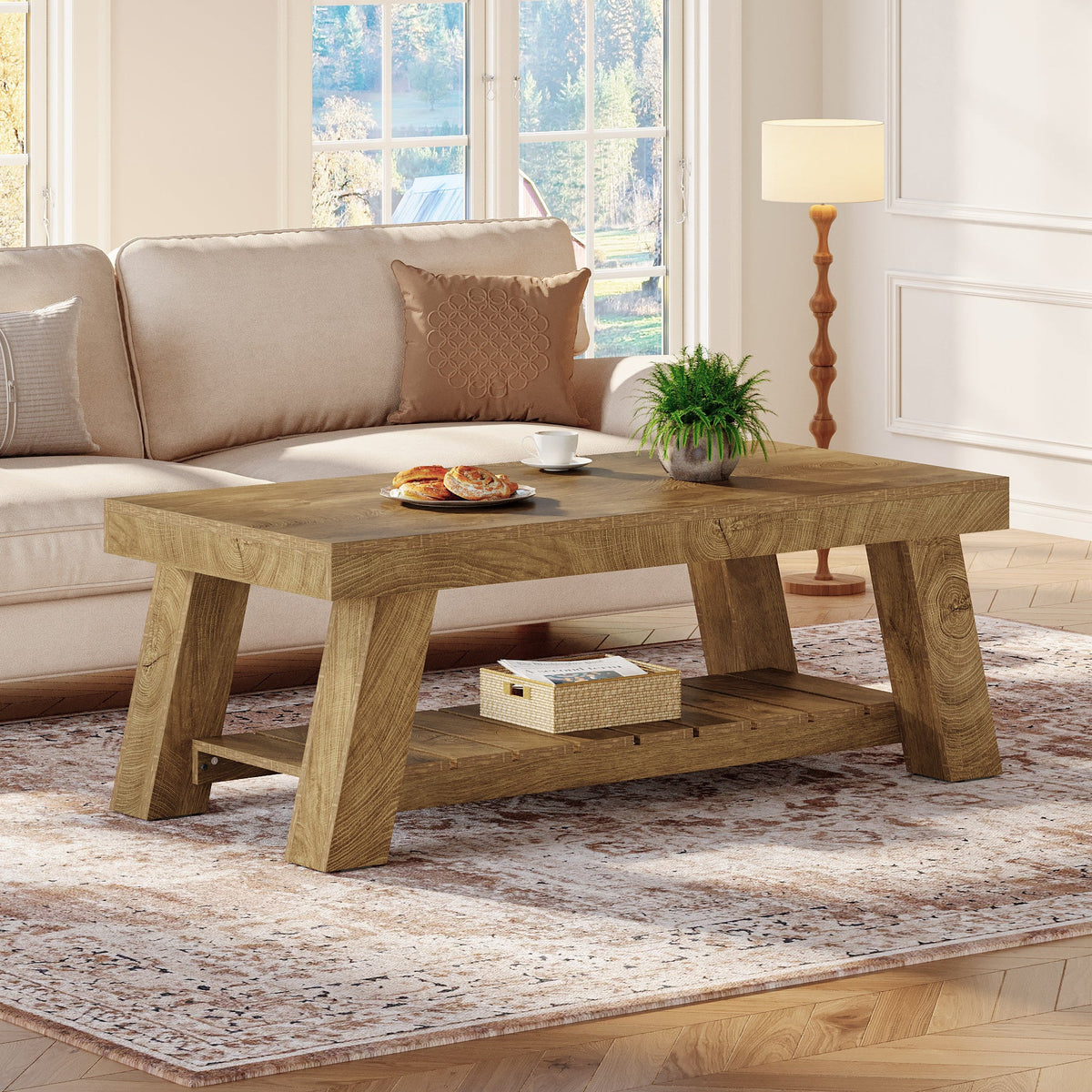 Brown A-frame coffee table with a tray of fruit in a bright living room