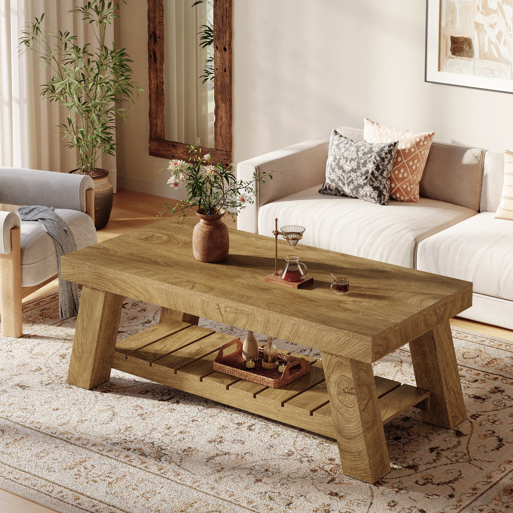 Vintage grain coffee table with plant and books in front of a white couch