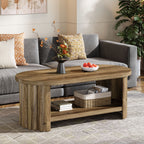 Oval two tier coffee table centered between a gray sectional and the TV wall