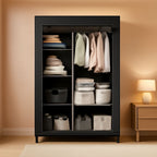 Black portable closet organizer 40.2 x 16.7 x 65.4 in in a bedroom, cover open showing hanging clothes on the left and six shelves of folded items on the right