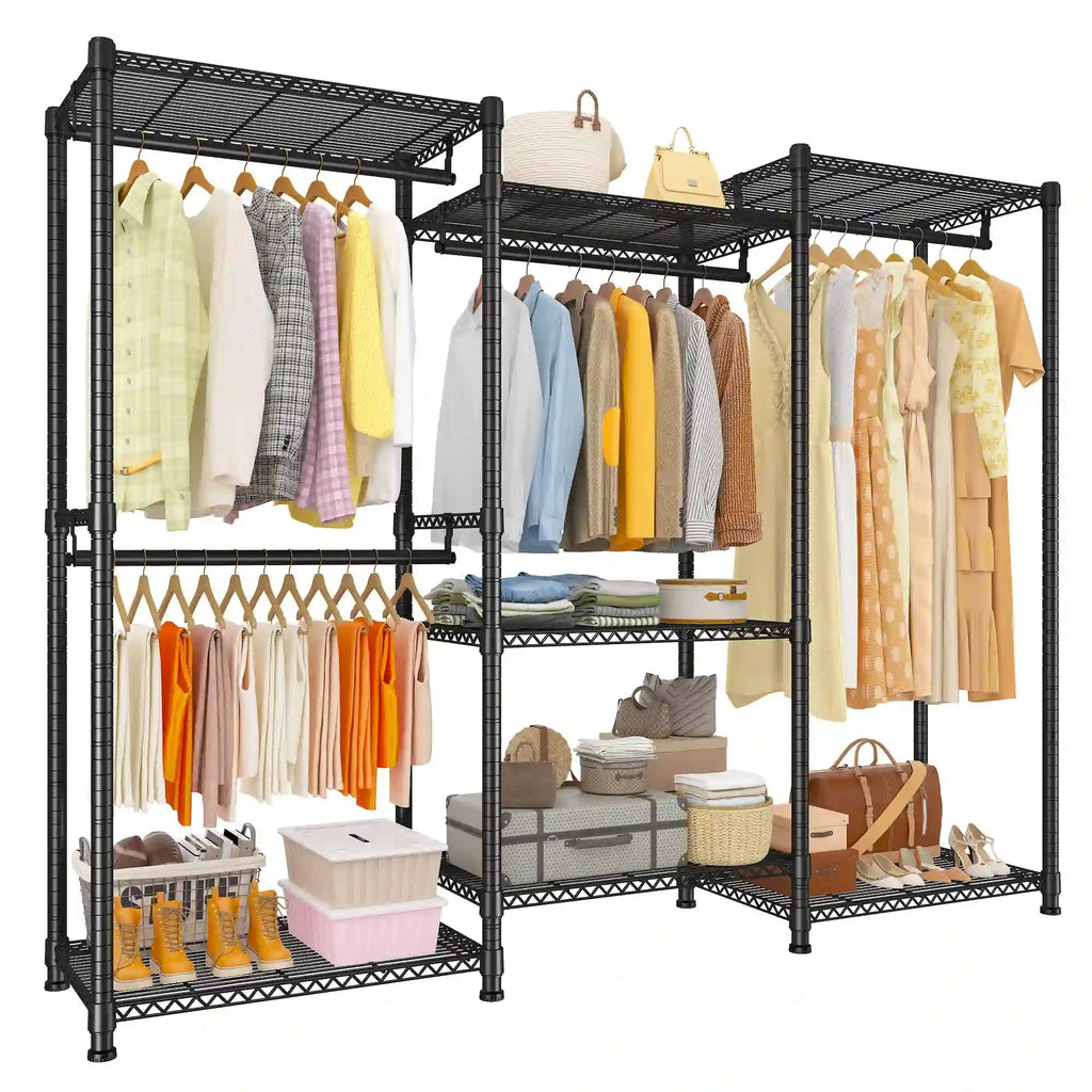 Black freestanding closet rack loaded with hanging shirts and dresses, shoes on the bottom shelf and storage boxes and baskets on the upper shelves