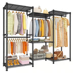 Black freestanding closet rack loaded with hanging shirts and dresses, shoes on the bottom shelf and storage boxes and baskets on the upper shelves