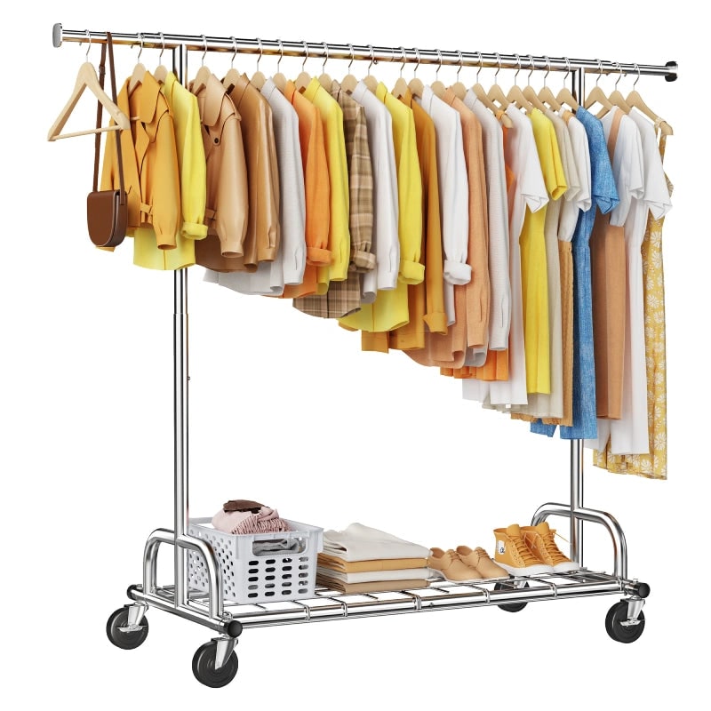 Chrome extendable rolling clothes rack on four swivel wheels, single hanging rod full of shirts and jackets, with a basket, folded clothes and shoes on the full length wire shelf below
