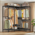 Black heavy duty clothes rack 76 x 18 x 77 in against a bedroom wall, seven rods holding shirts and dresses with folded stacks and baskets on the wire shelves