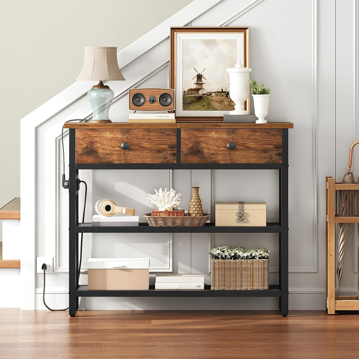 Rustic brown entry table with 2 fabric drawers and mesh shelves by a staircase