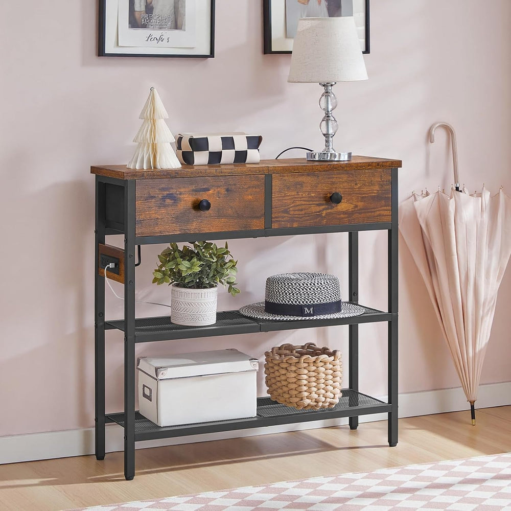 Narrow console table with drawers and baskets against a pink wall