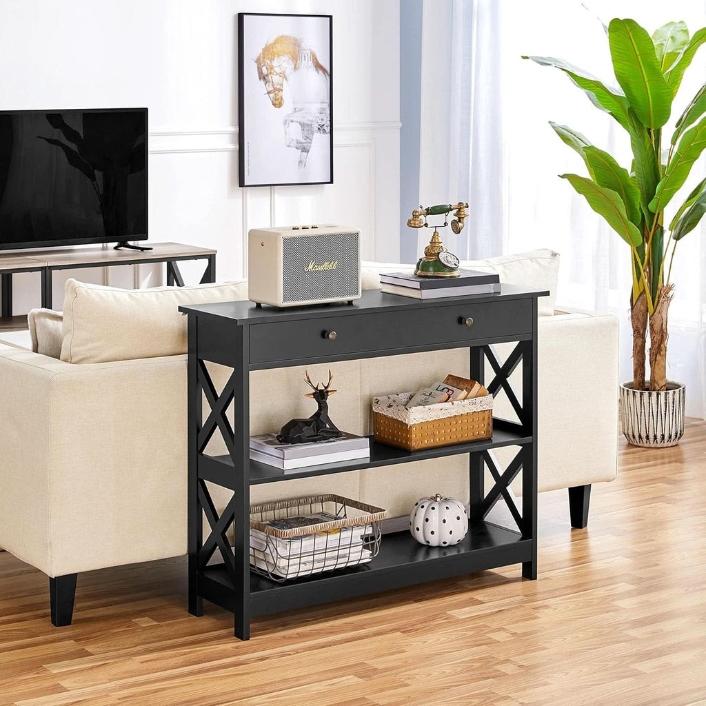 Black console table with drawer used behind a sofa in a living room