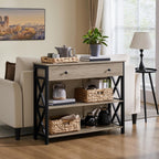 Gray sofa table with drawer behind a cream sofa holding a tea tray