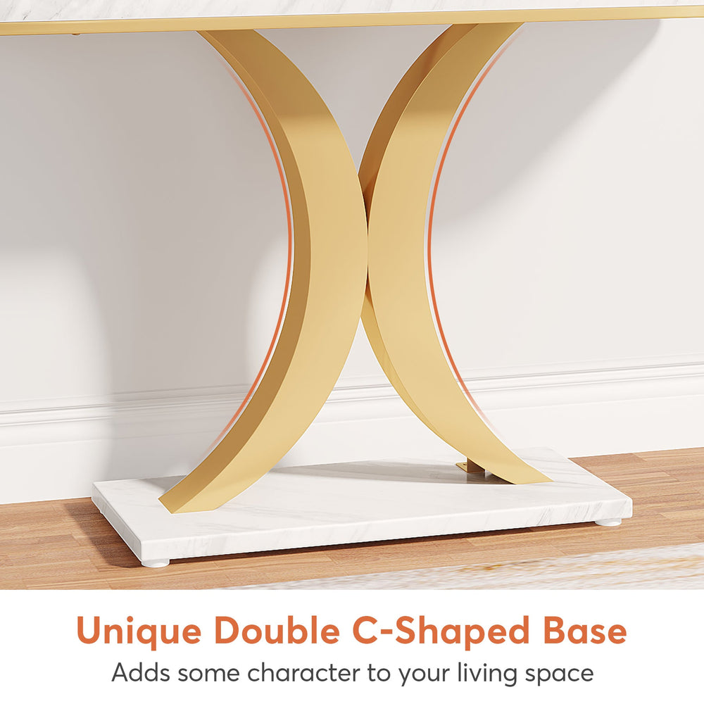Close view of the gold double C shaped base meeting on its central plinth