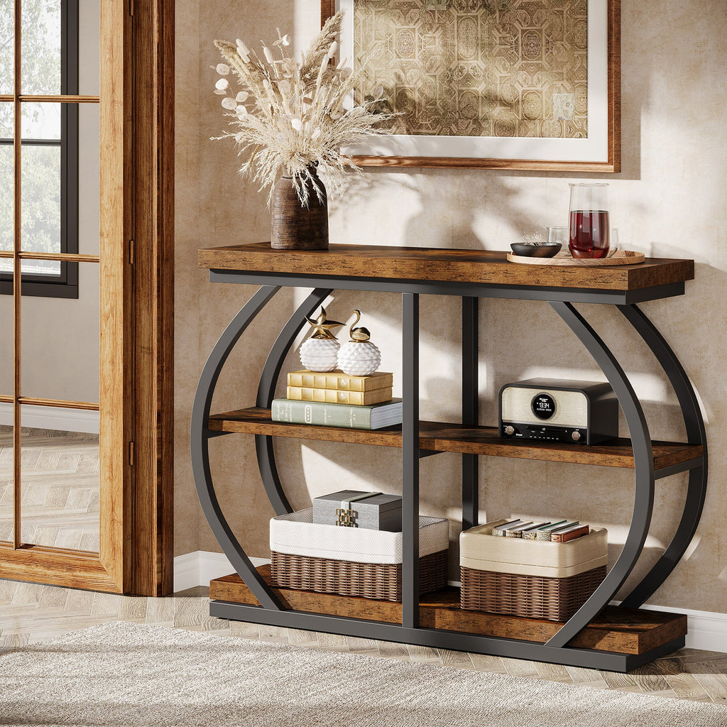 Three tier console table beside a doorway with baskets on the lowest shelf