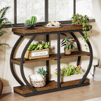 The open arched frame seen from the side with plants on all three levels