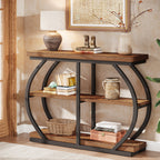 Brown console table styled with a lamp, books and pottery in a hallway