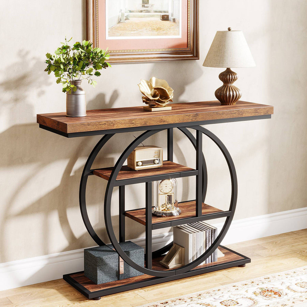 The circle base console against a wall with a vase, lamp and gold ornament on the tabletop