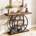 The circle base console against a wall with a vase, lamp and gold ornament on the tabletop