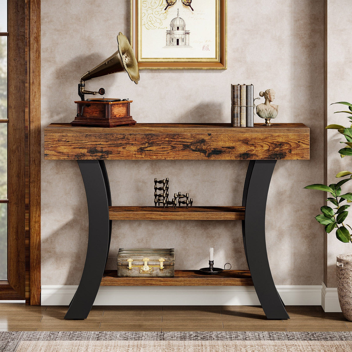 Curved 3 tier console table styled with a gramophone and books