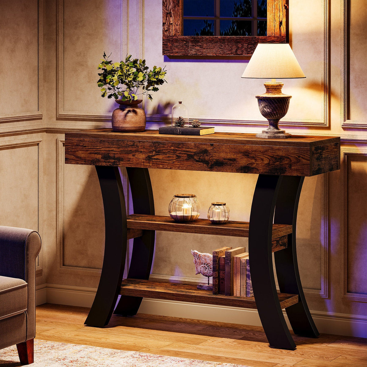 Dark brown curved sofa table with a lamp in a warm lit room