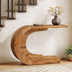 Rustic brown C shaped console photographed against a plain background from the front