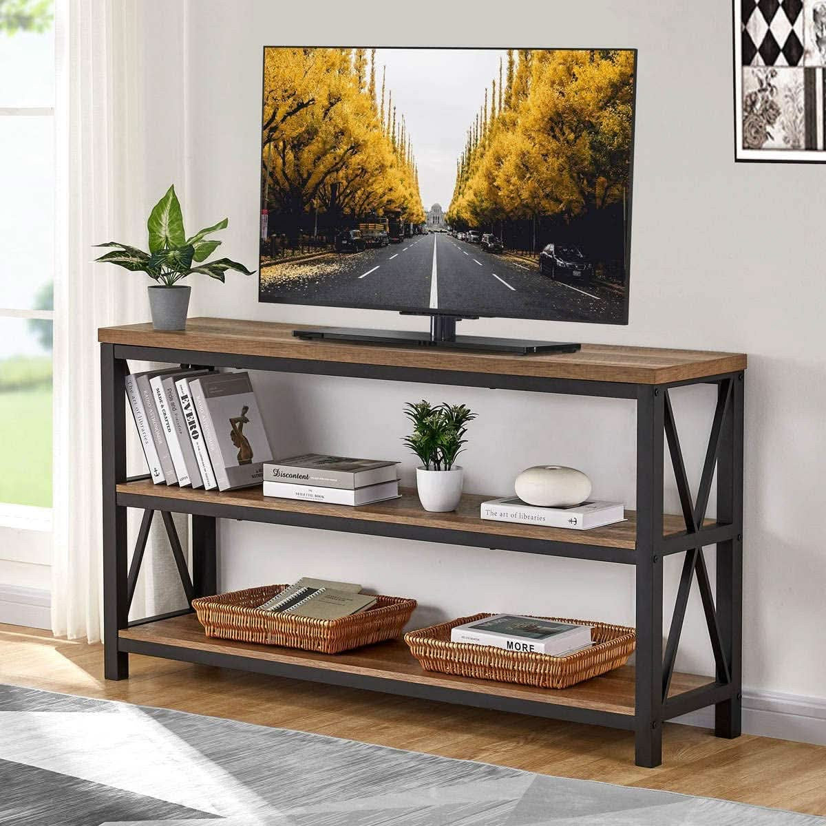 55 inch console table used as a TV stand in a bright room