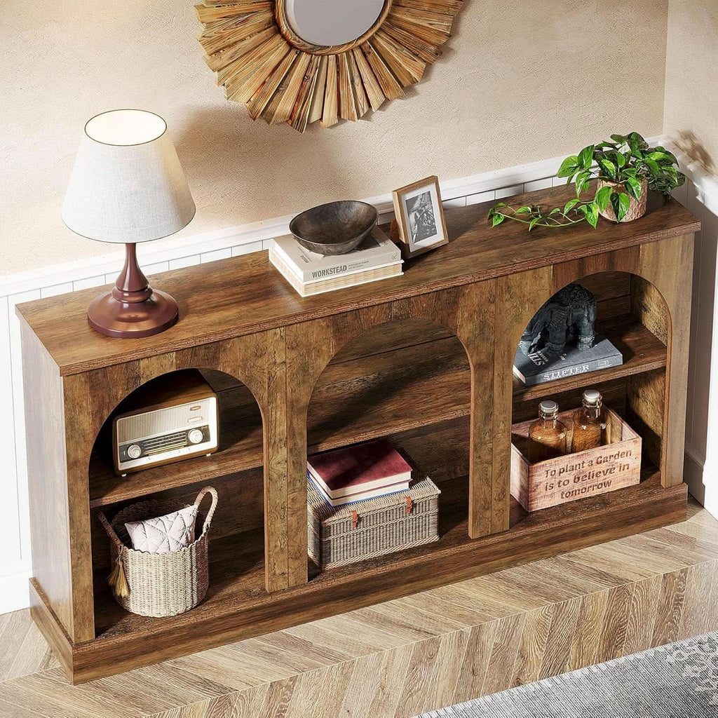 Vintage brown arched console table under a round mirror