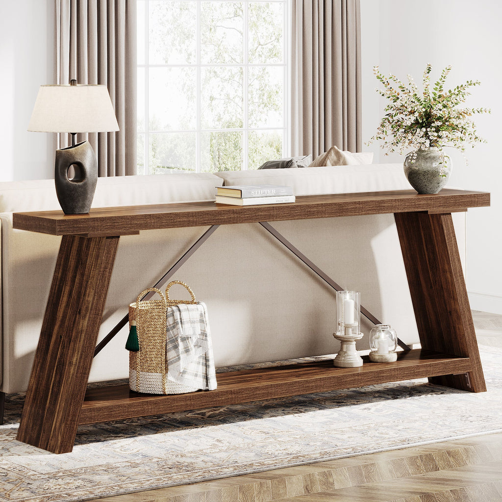 Extra long sofa table behind a couch holding a lamp and books