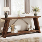 Extra long sofa table behind a couch holding a lamp and books