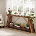 Two tier console table under a window with plants along the lower shelf
