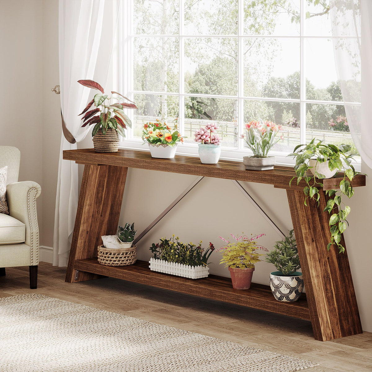 Two tier console table under a window with plants along the lower shelf