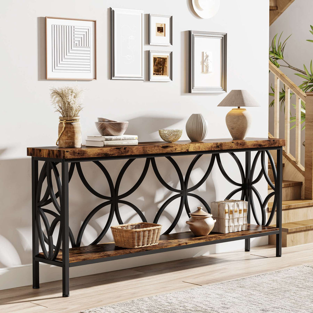 Rustic brown console table with decor beside framed prints