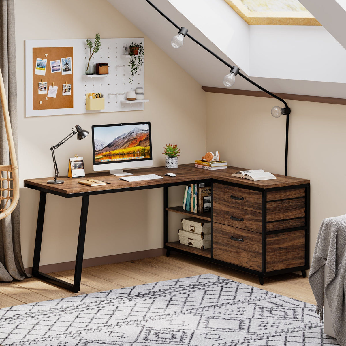 L desk under a sloped ceiling with a desk lamp and corkboard