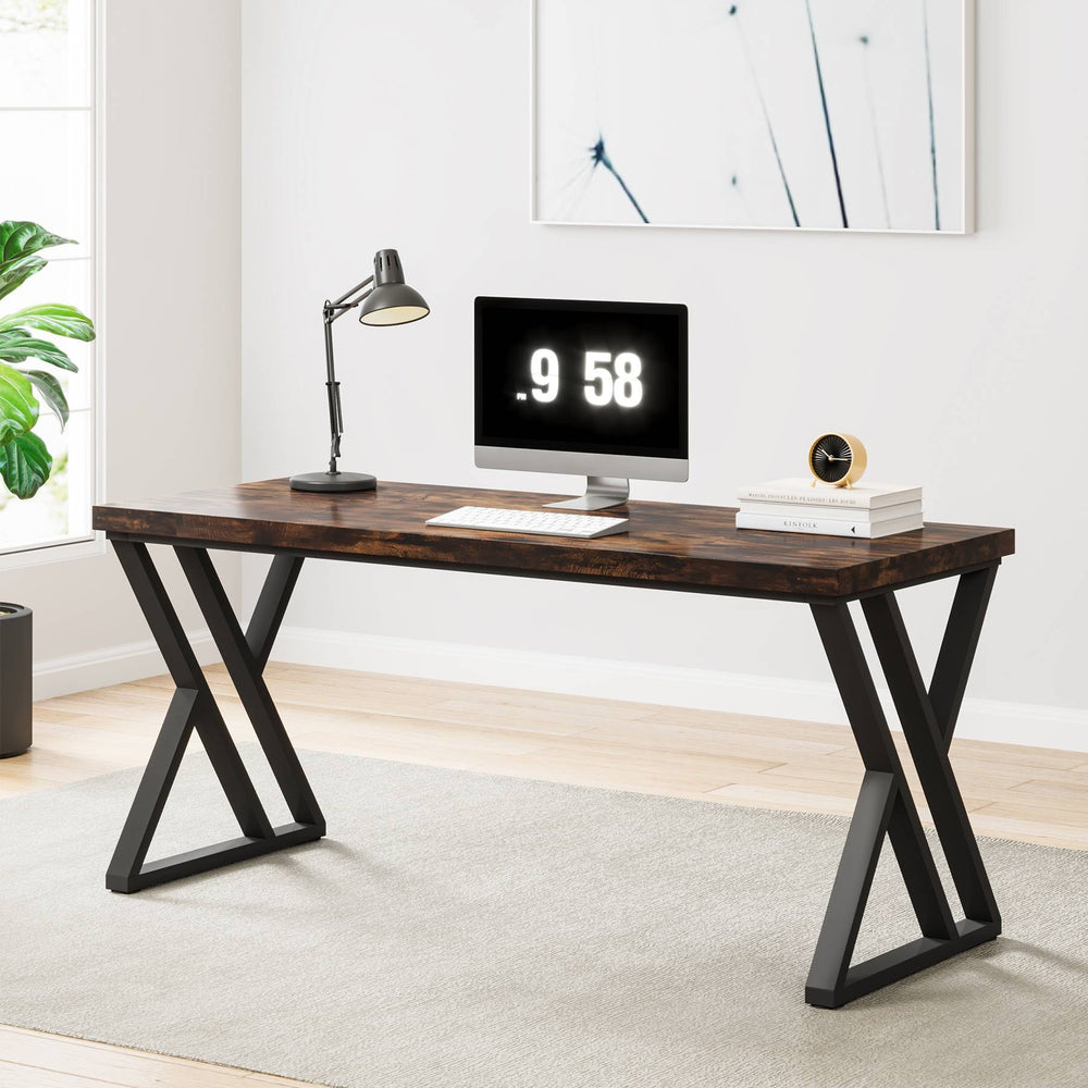 Rustic brown desk with monitor and desk lamp in a home office