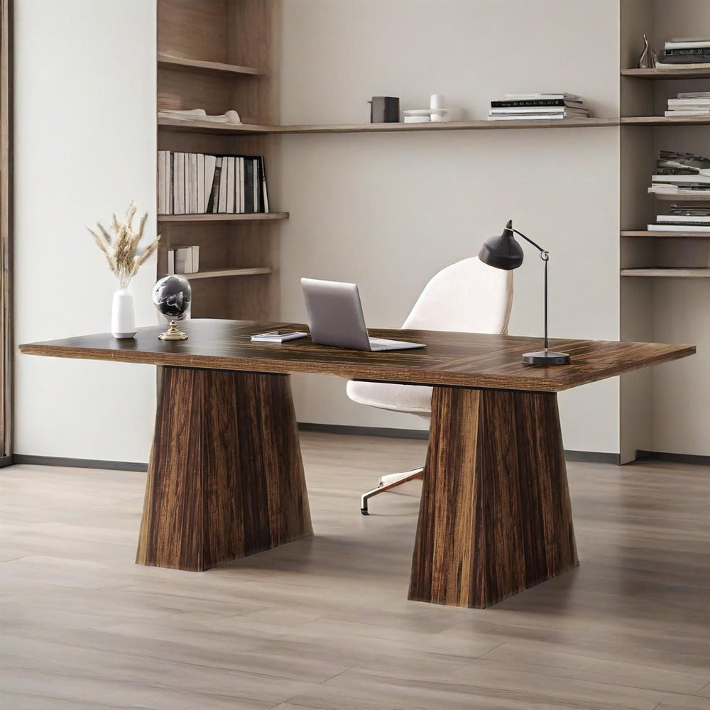 63 inch executive desk in front of built-in shelves with a laptop, globe and vase